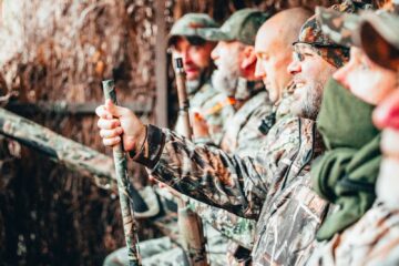 a group of hunters in a forest